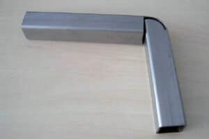 Close-up of a metallic tube with a precise angled tube laser cut, showcasing the smooth surface and finish indicative of high-quality tube laser cutting services.