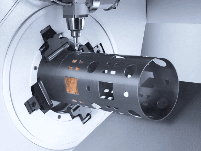 Close-up of tube laser cutting process for a cylindrical stainless steel piece with cutouts in a rube laser, showcasing advanced technology and custom metal fabrication capabilities.
